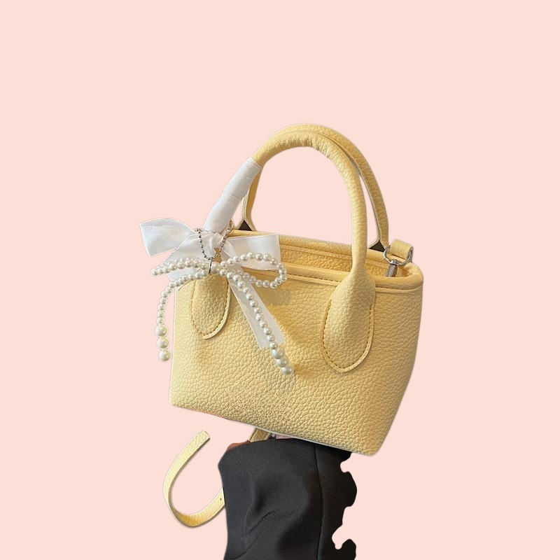 กระเป๋าถือผู้หญิงทรงถัง สีพื้น สไตล์มินิมอล 2025