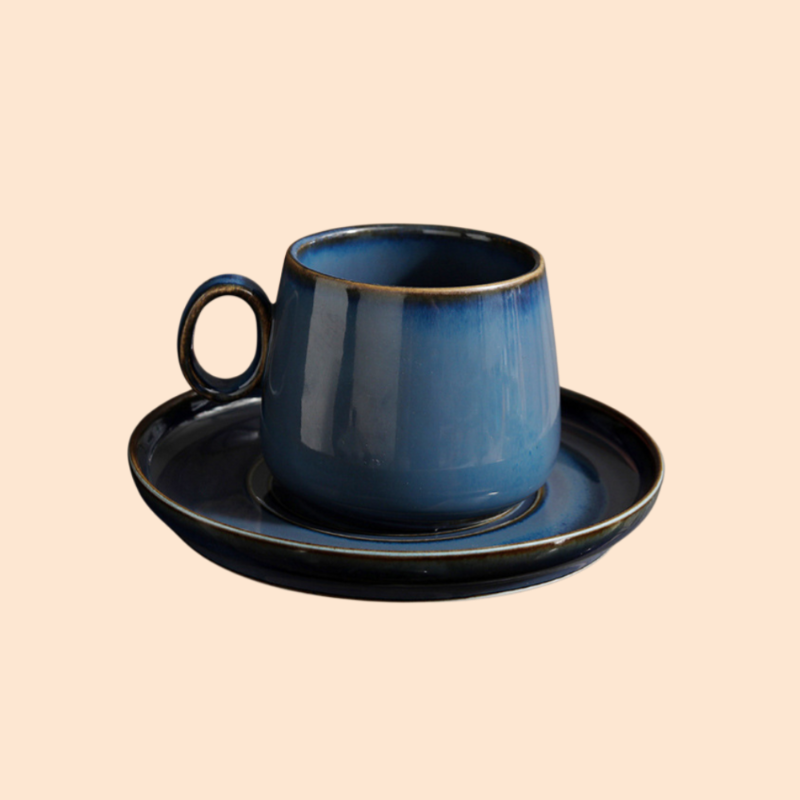 Kiln-changed coffee cup and saucer set