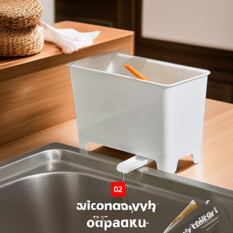 Kuchyňský odpadkový koš vedle dřezu na odkapávající kuchyňský odpad