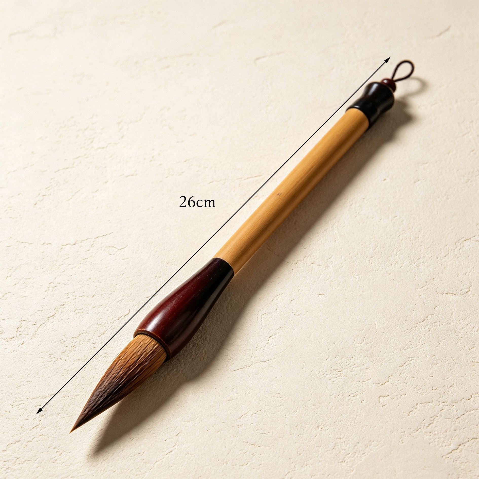 Artist using bamboo-handled brush for Chinese calligraphy