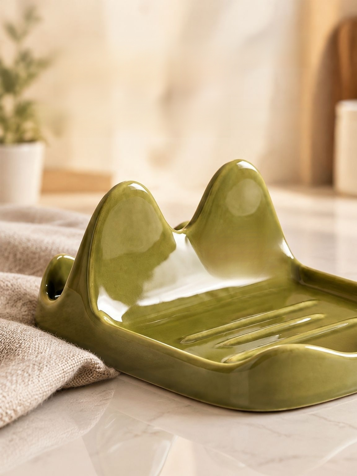 Kitchen organizer keeping cooking spoons and cookware lids within reach