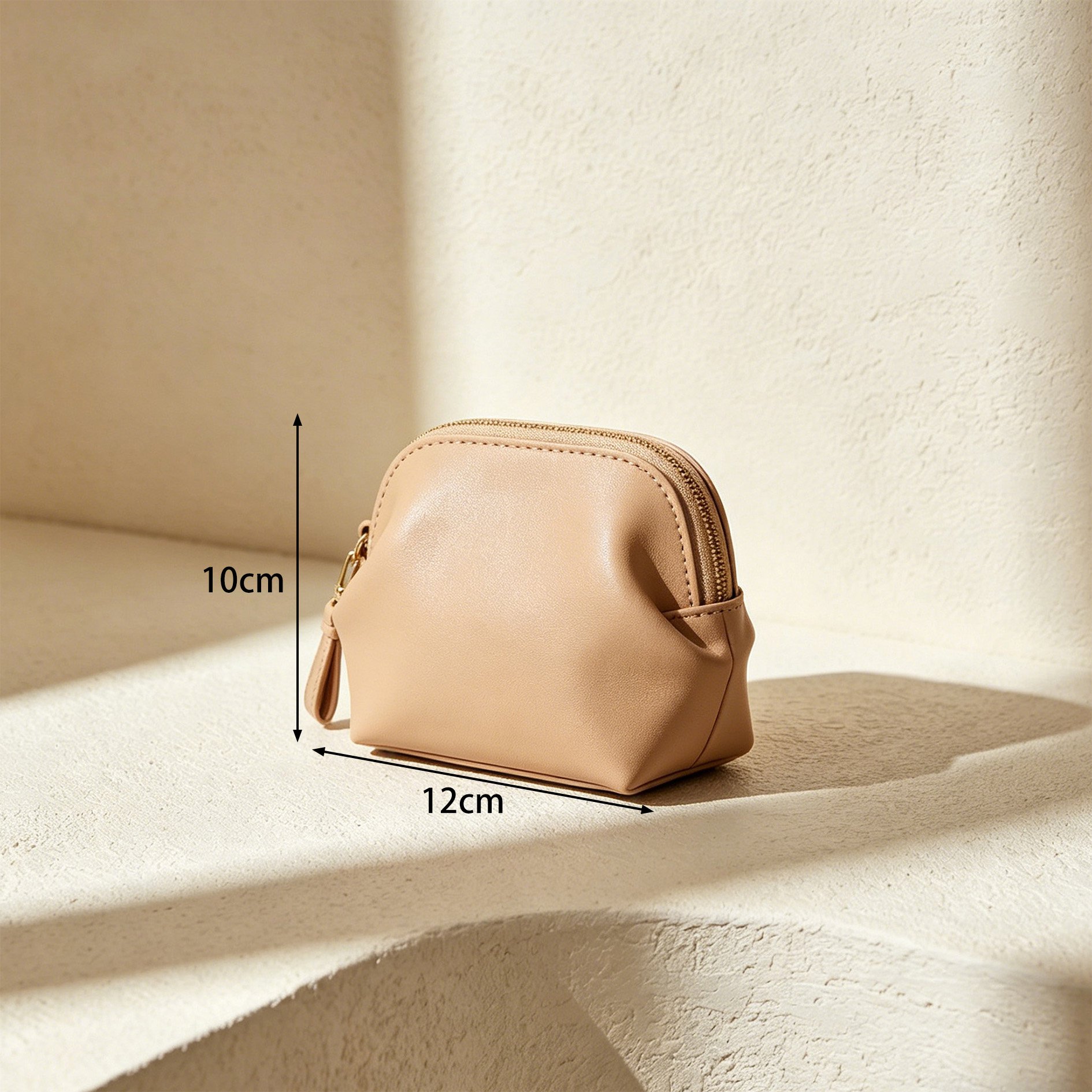 Compact organizer bag in hand for scale