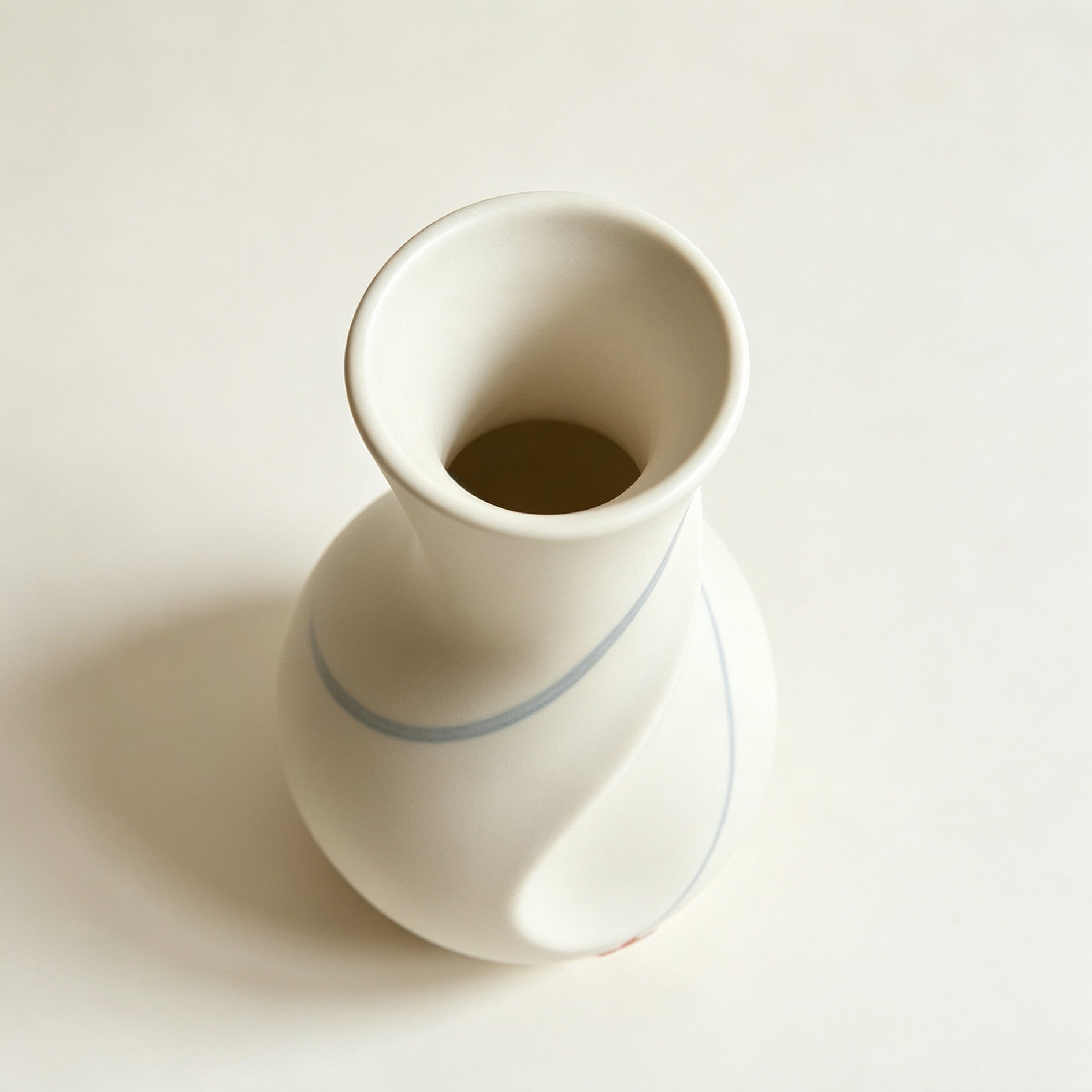 Side profile of twisted-neck vase with maple pattern