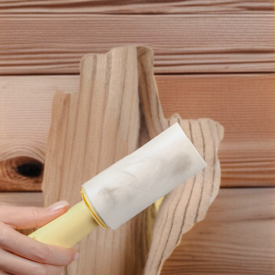 Close-up of fabric shaving roller removing lint