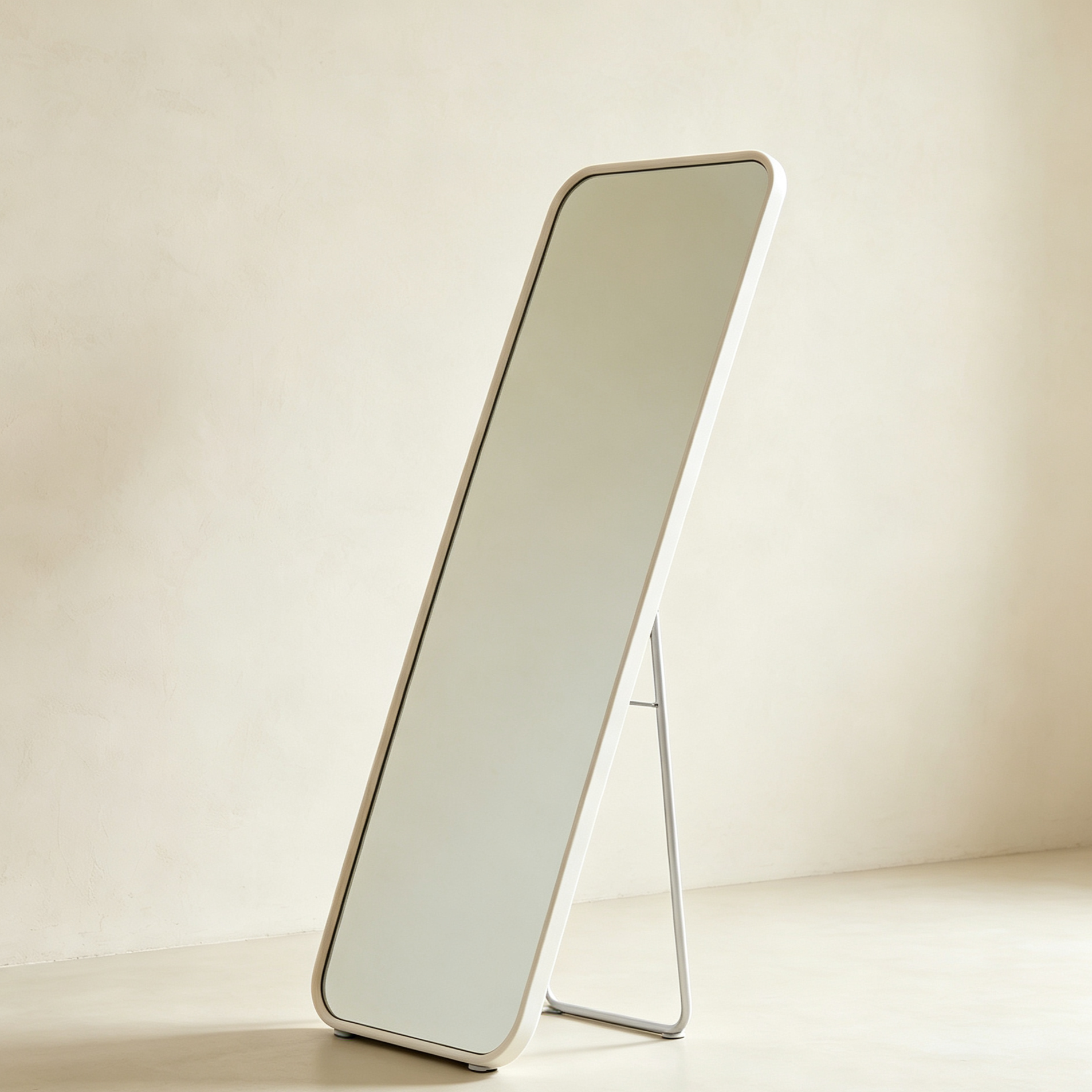 Set of two full-length floor mirrors standing side by side in a modern bedroom