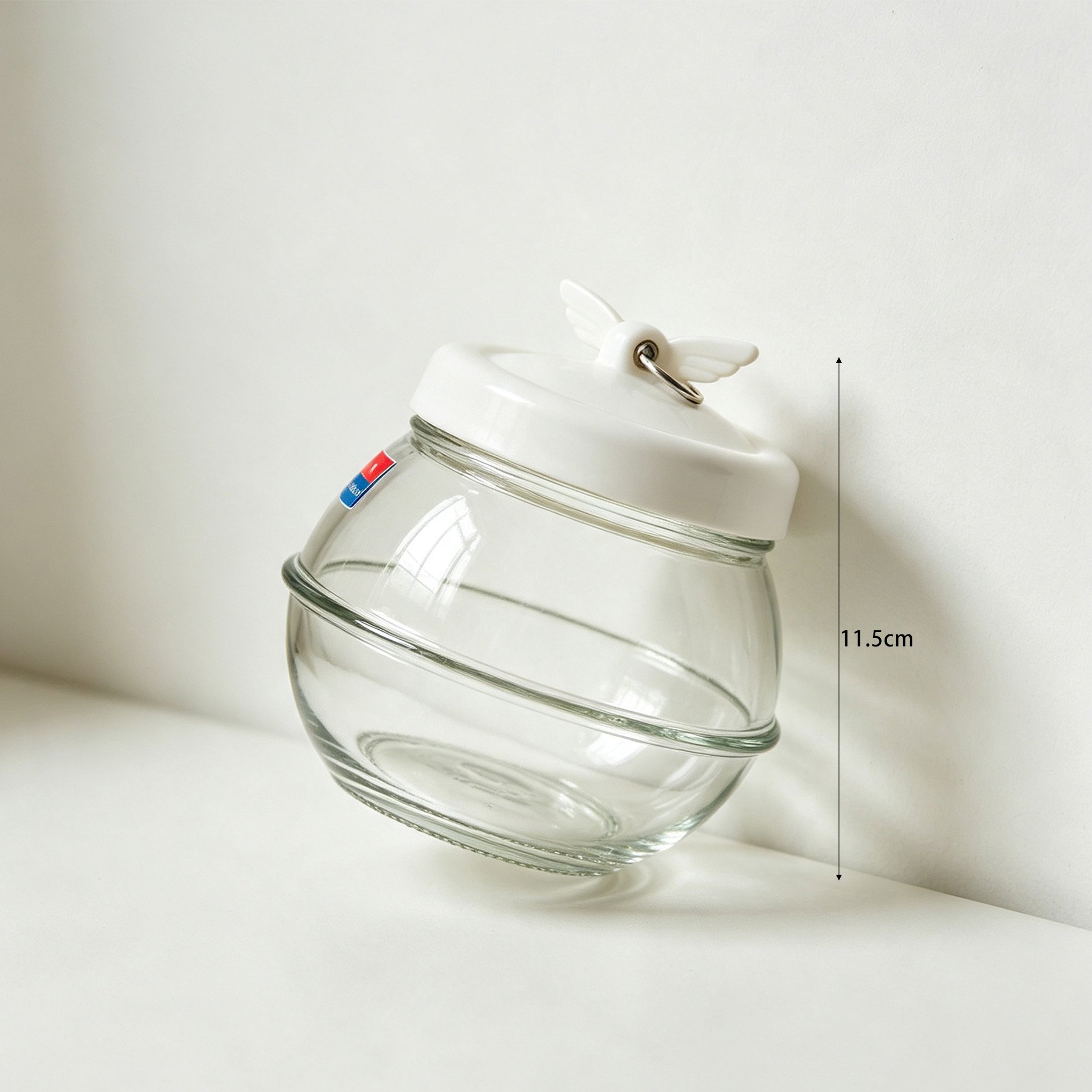 Close-up of Angel Wings Design on Glass Jar