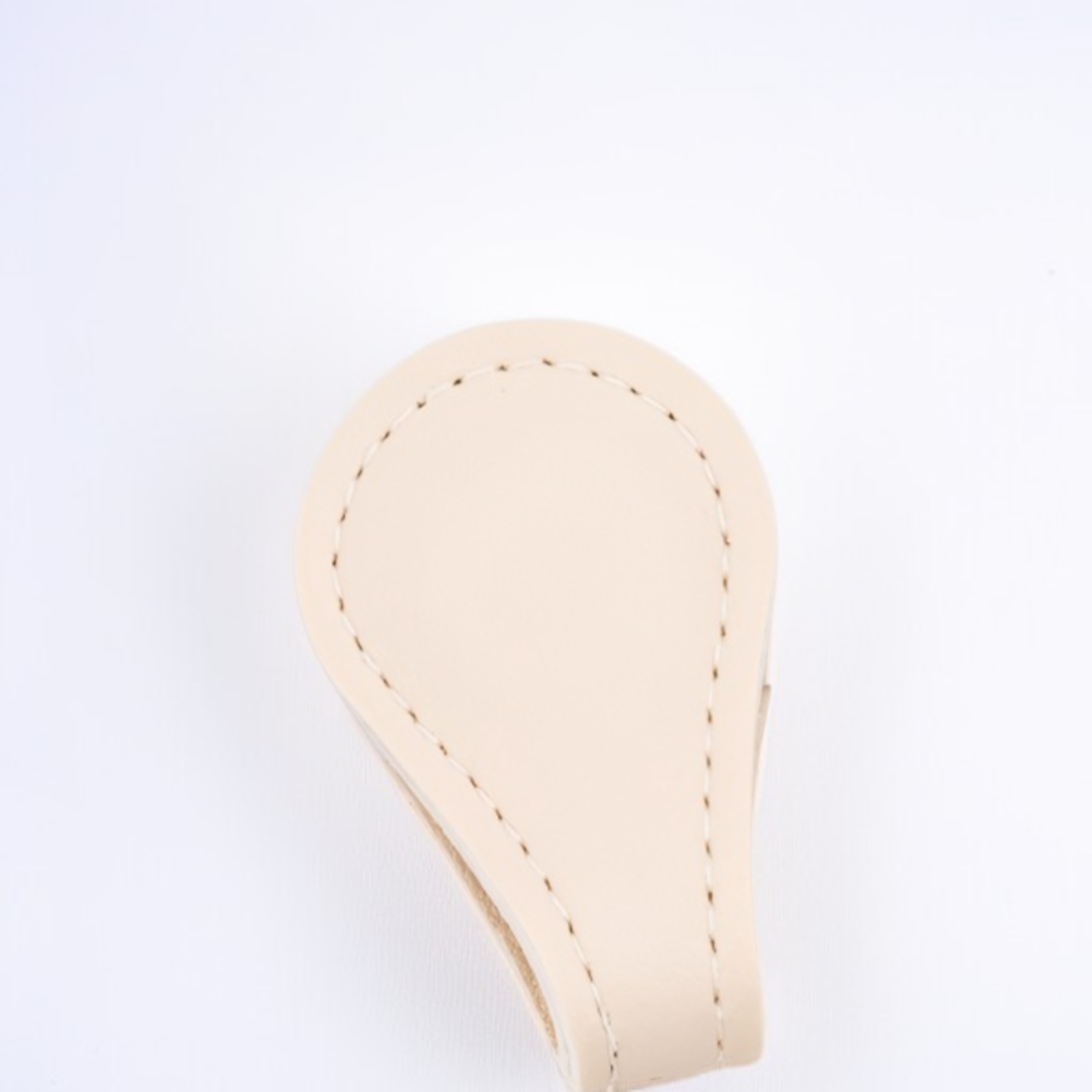 Trouser hem folded and secured with magnetic snap fasteners