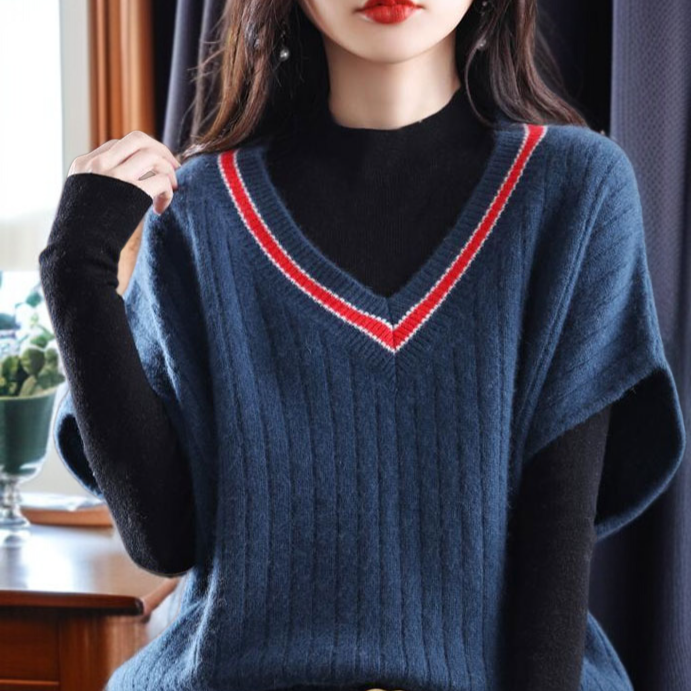 ニットの底の外にゆるいセーターの馬甲女性vネックの肩のセーターの外にゆるい馬甲がついている