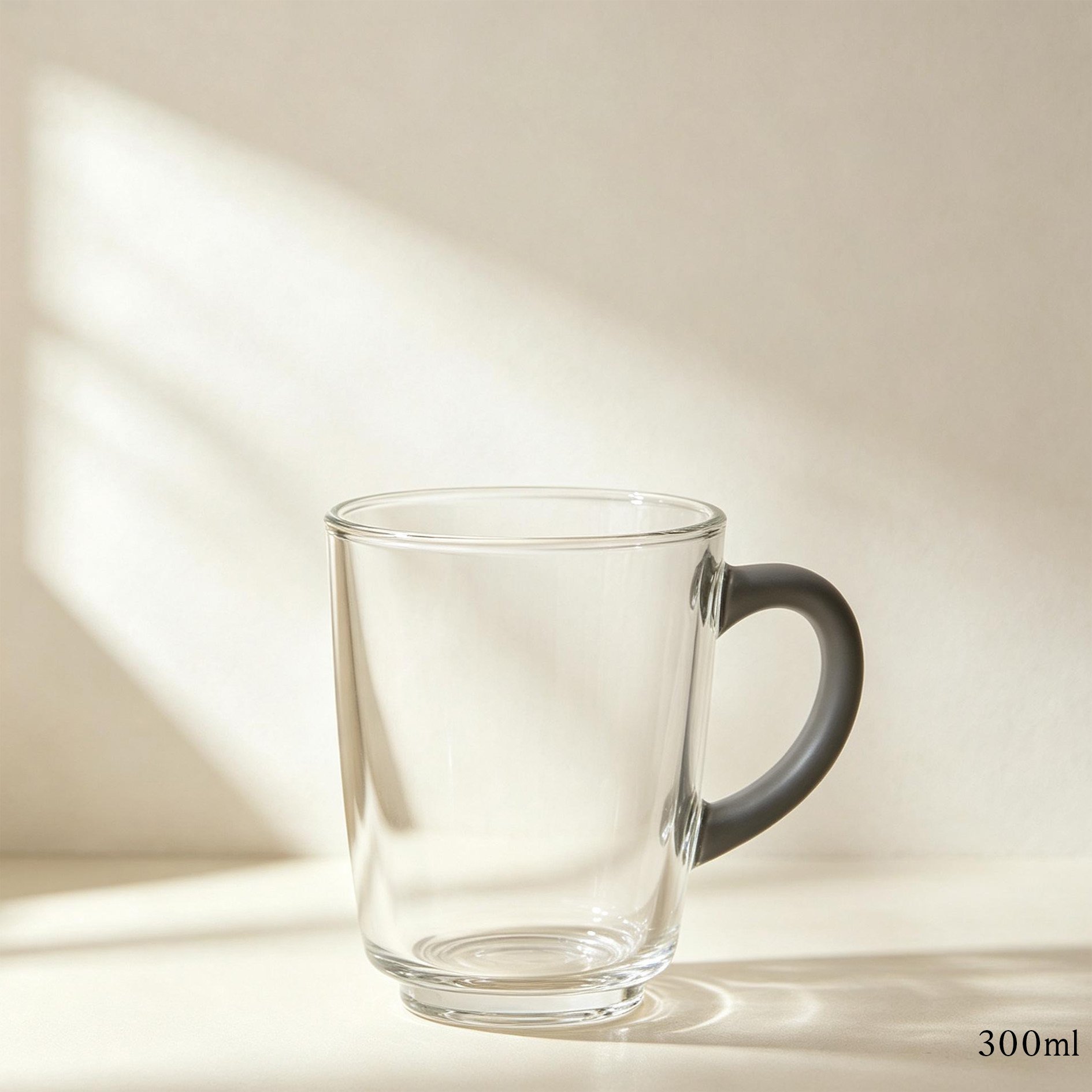 Glass-handled mugs set displayed with tea and pastries