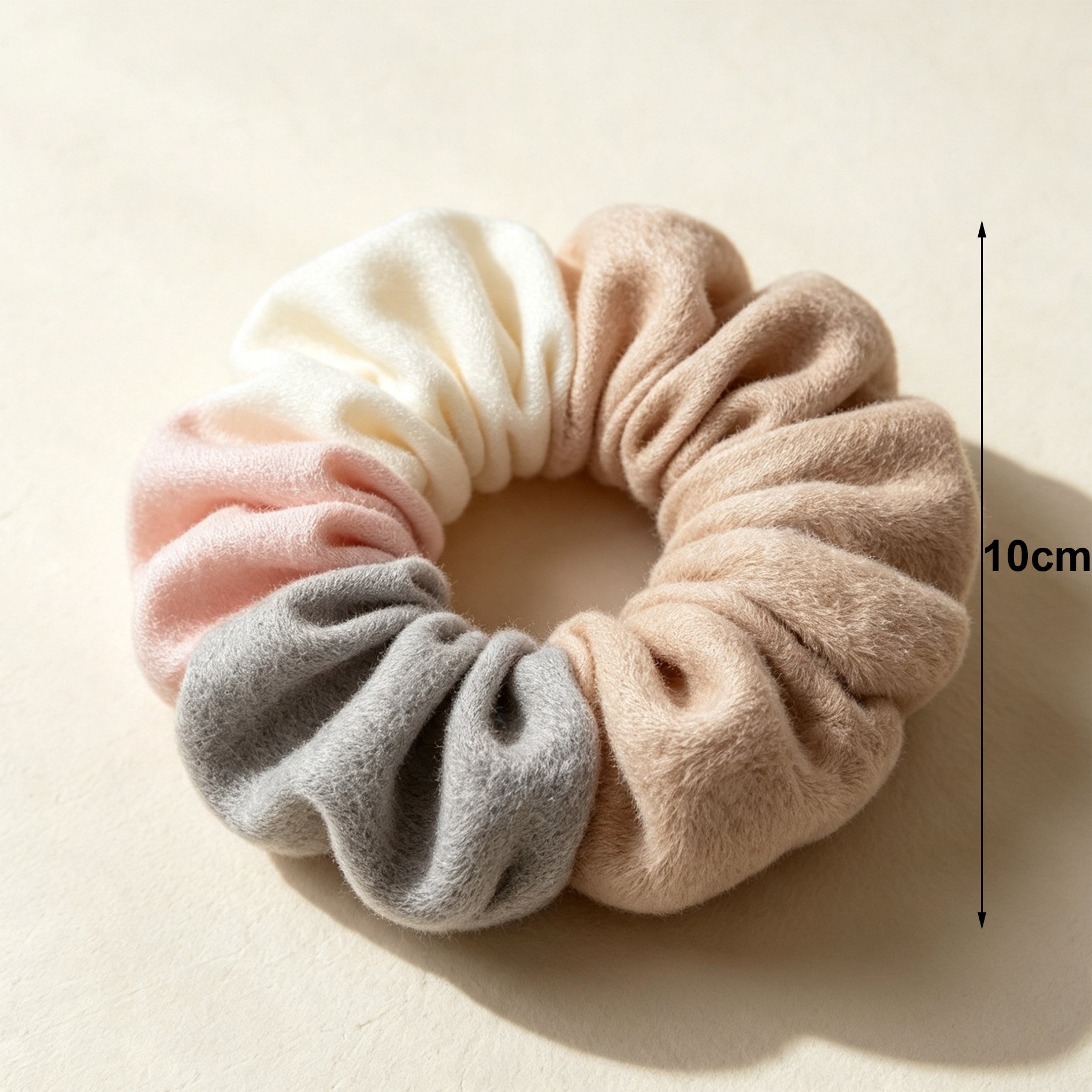 Pile of color-blocked hair scrunchies with soft texture