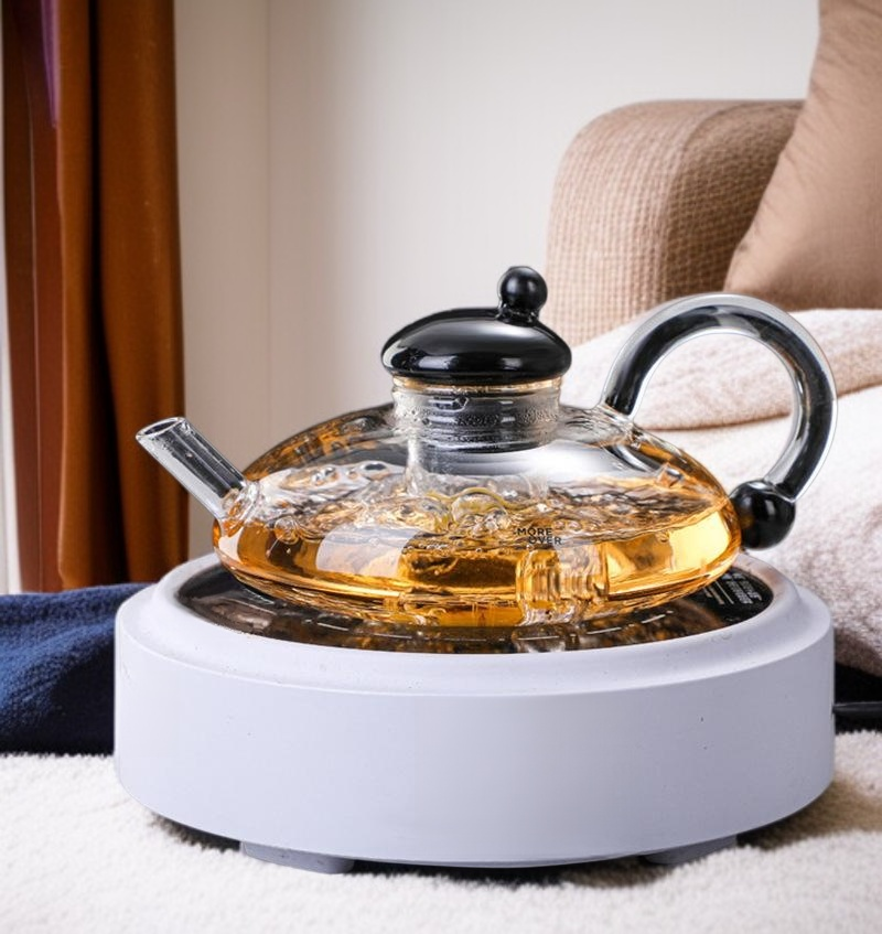Elegant clear glass teapot showcasing blooming tea