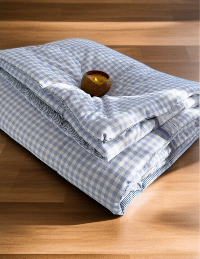 Air conditioning quilt folded on chair