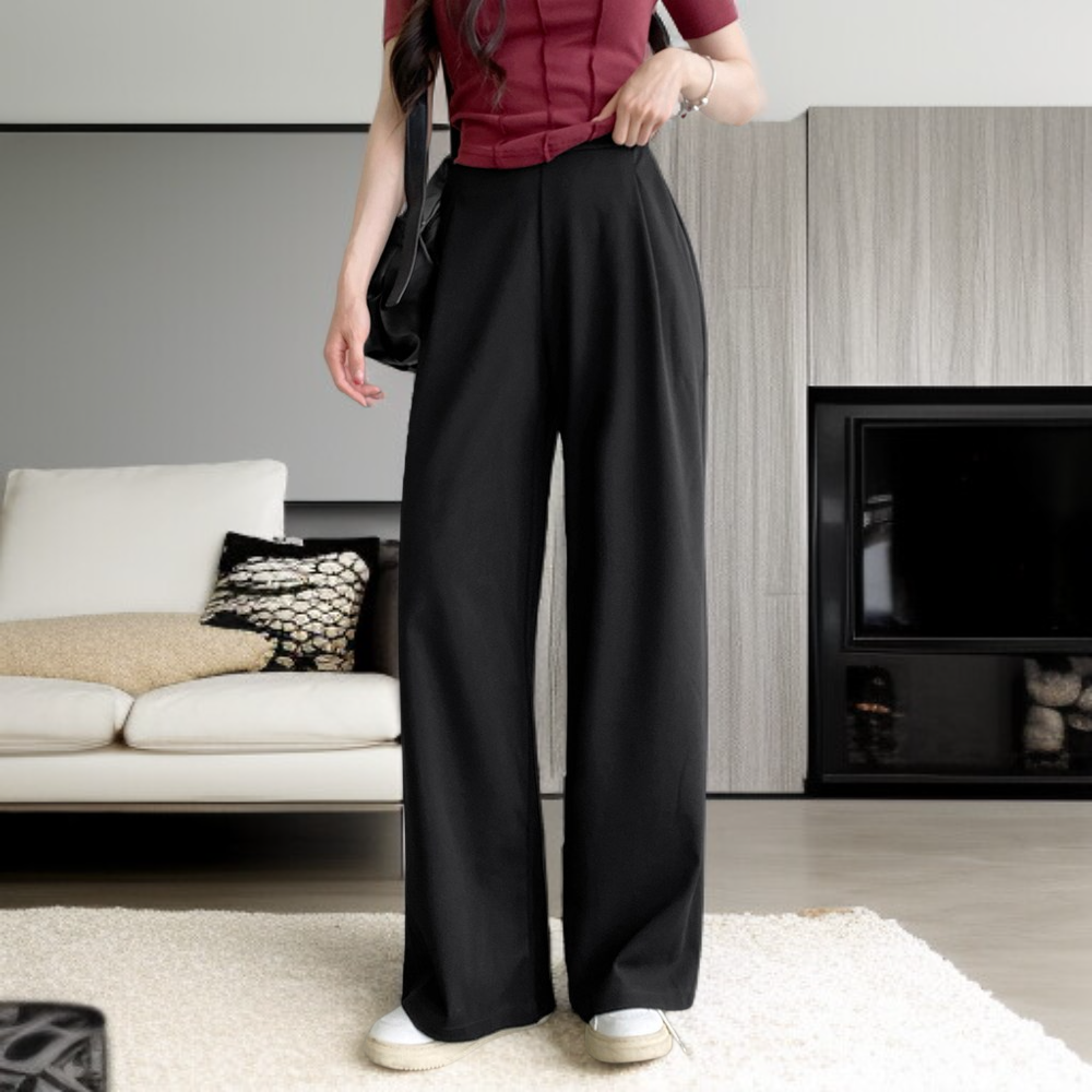 Schmal geschnittene, weit geschnittene Damenhose mit hohem Bund und schmeichelhaftem Fall.