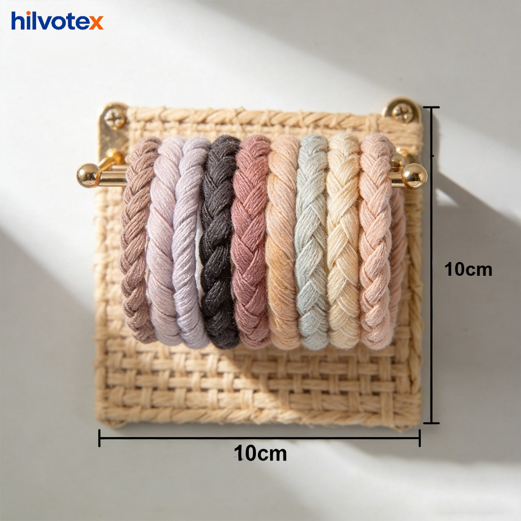 Woven hair tie rack in a modern bathroom setting
