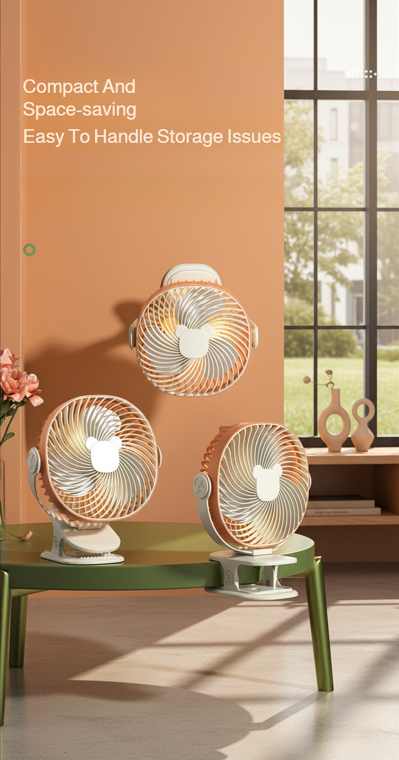 Portable desktop fan clipped to table edge