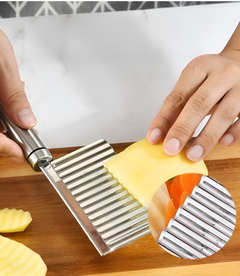 Stainless steel French fry knife on cutting board