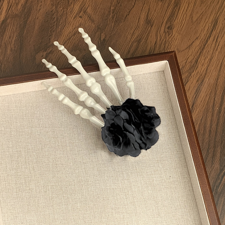 Horquilla de calavera con hueso de mano