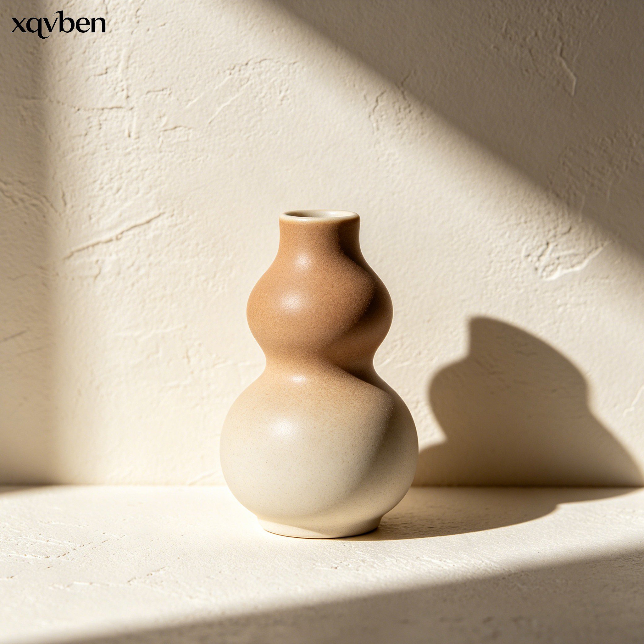 Mini ceramic vase with fresh flowers on a wooden table