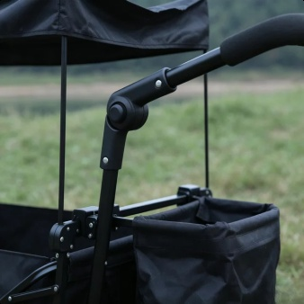 Outdoor folding camping wagon with canopy in a park setting
