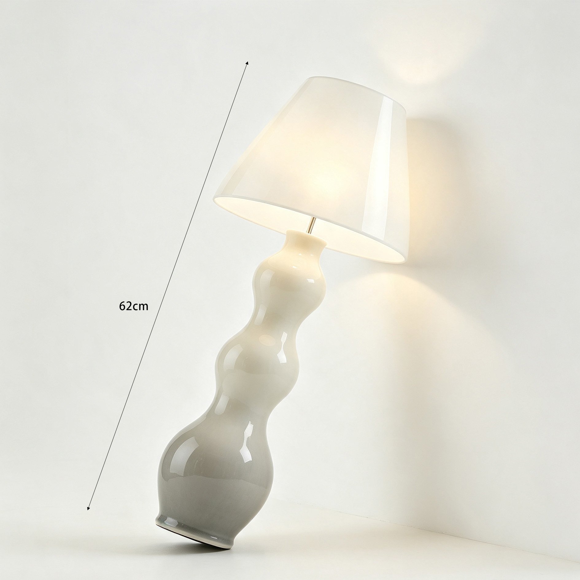 Gradient ceramic floor lamp next to sofa