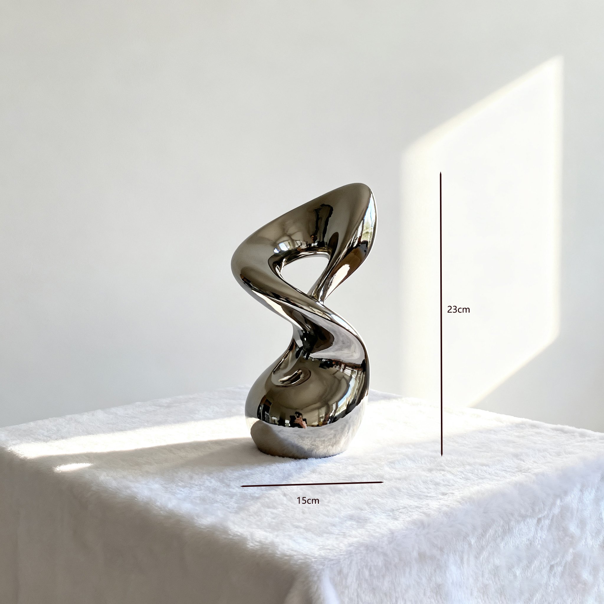 Escultura de acero inoxidable como centro de mesa