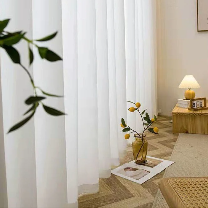 Luxurious hotel style chiffon drapes in a cozy setting