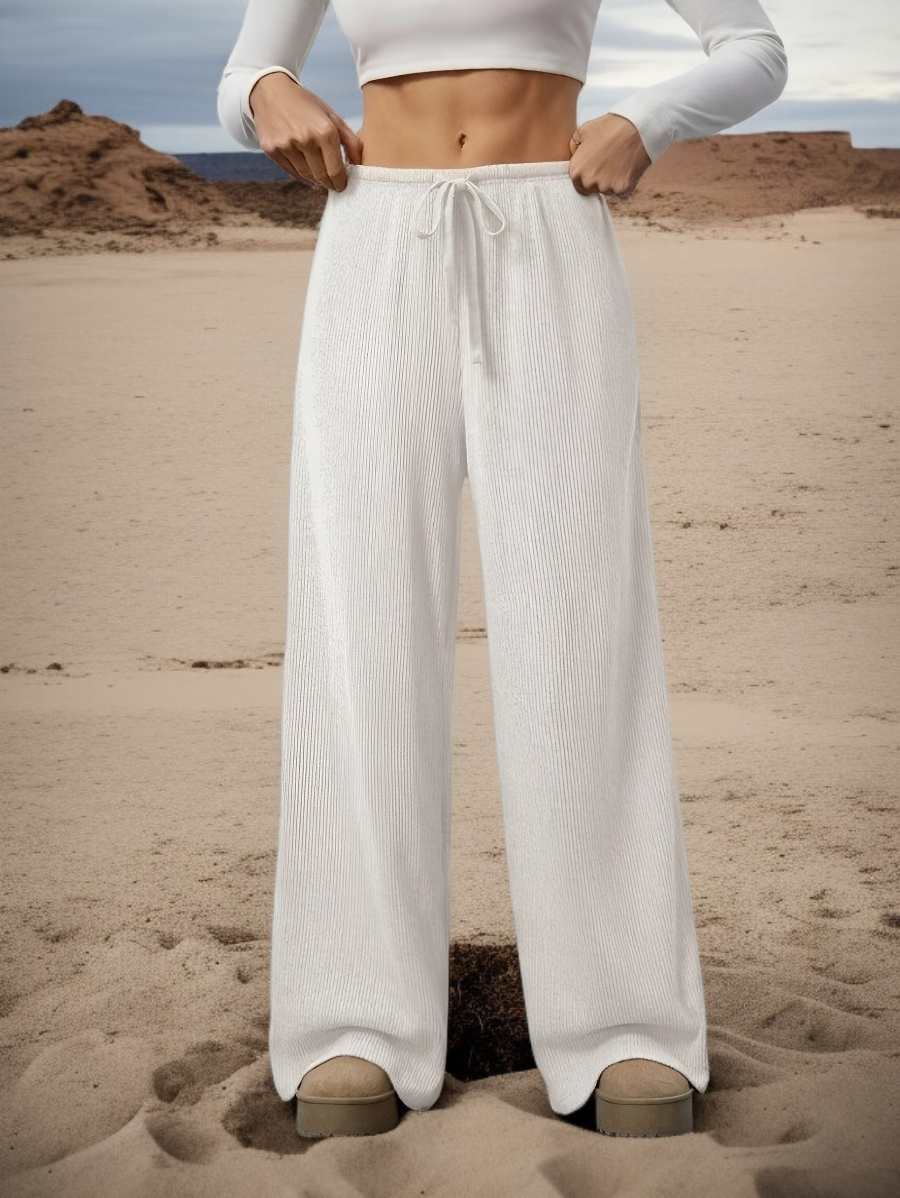 بنطال نسائي واسع الساق بخصر منخفض مطاطي ولون سادة