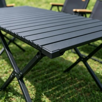 Outdoor folding table and chairs ready for a family picnic