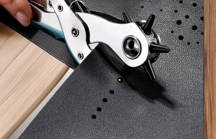 Adjustable German type belt hole punch tool