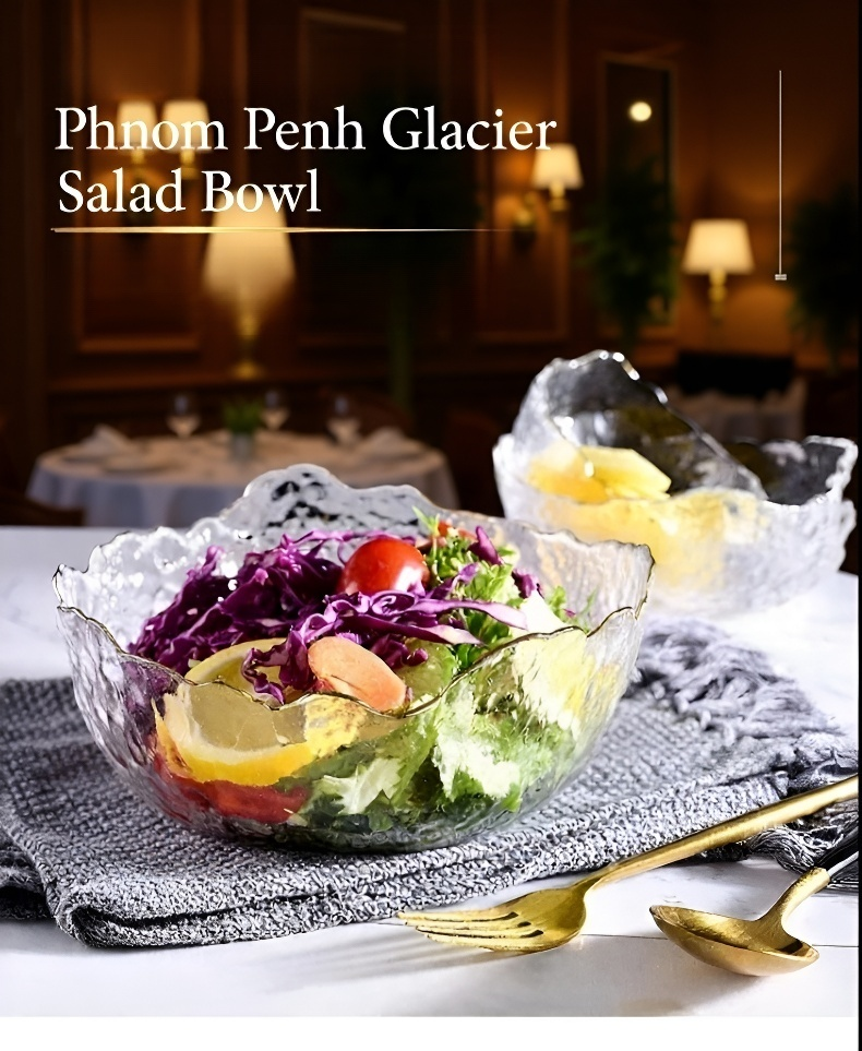 Hammered clear glass bowl with gold rim on dining table