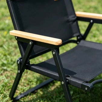 Camping table and chair kit displayed beside a tent