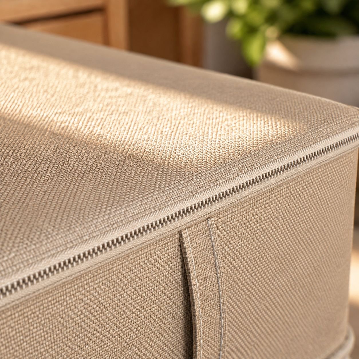 Large foldable storage organizer filled with bed linens
