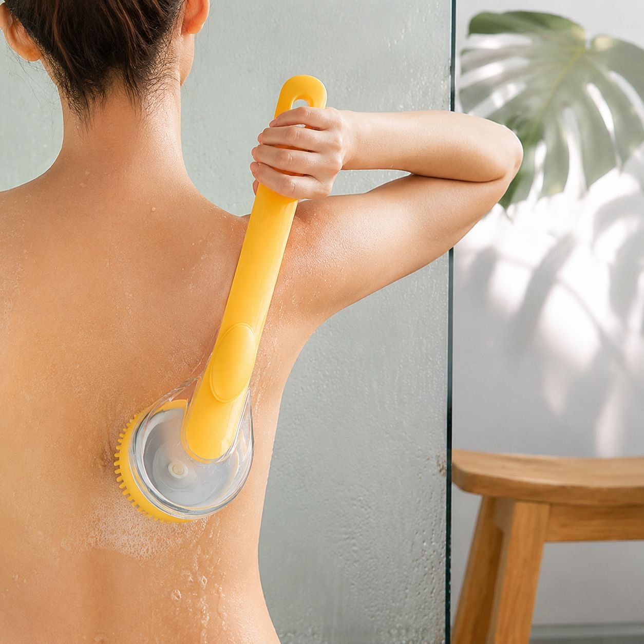 Pet grooming brush with ergonomic long handle design