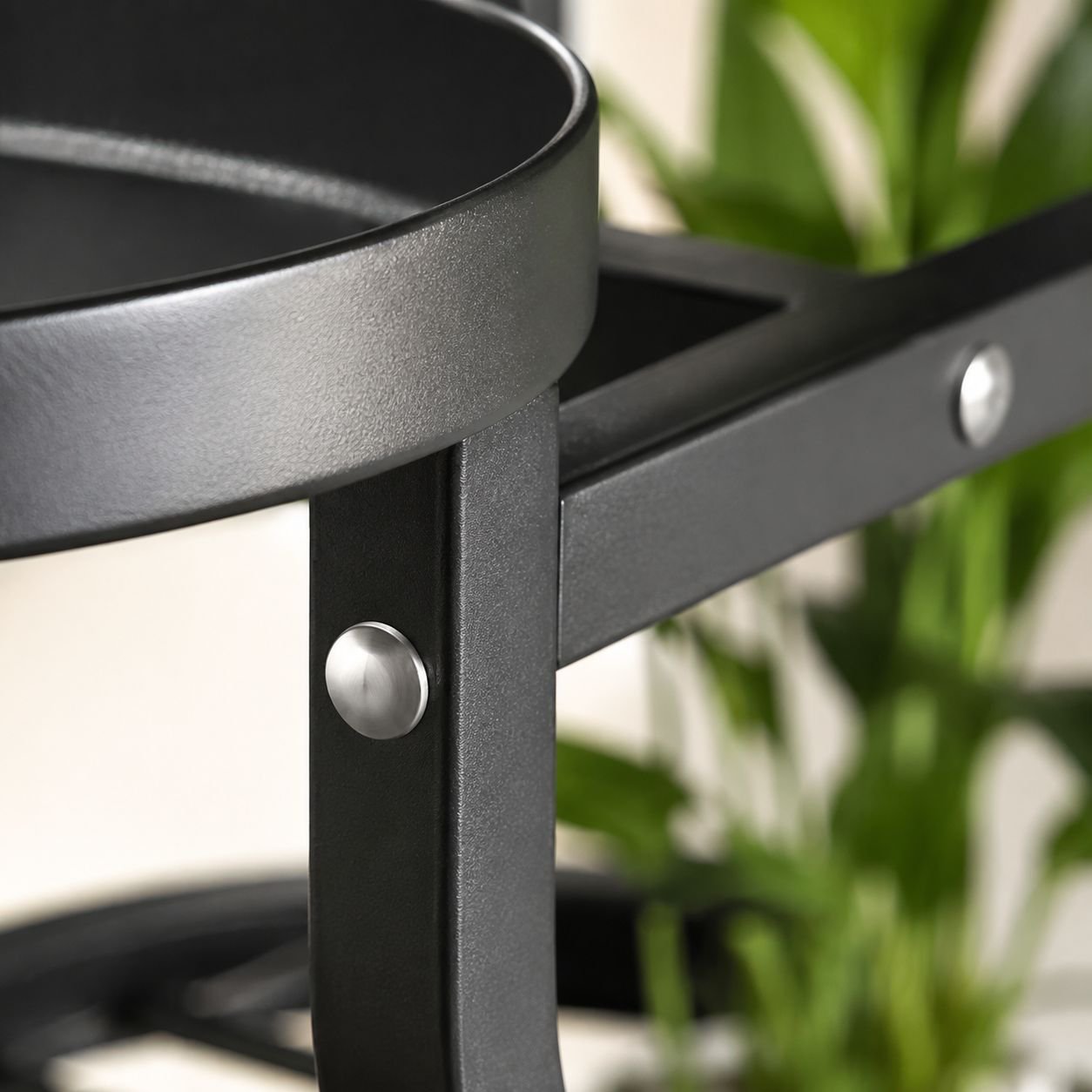 Scandinavian style plant stand with potted plants