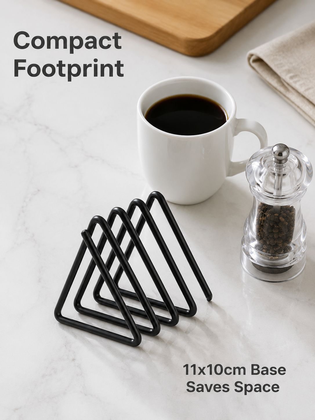 Iron kitchen rack holding cutting boards upright and within reach