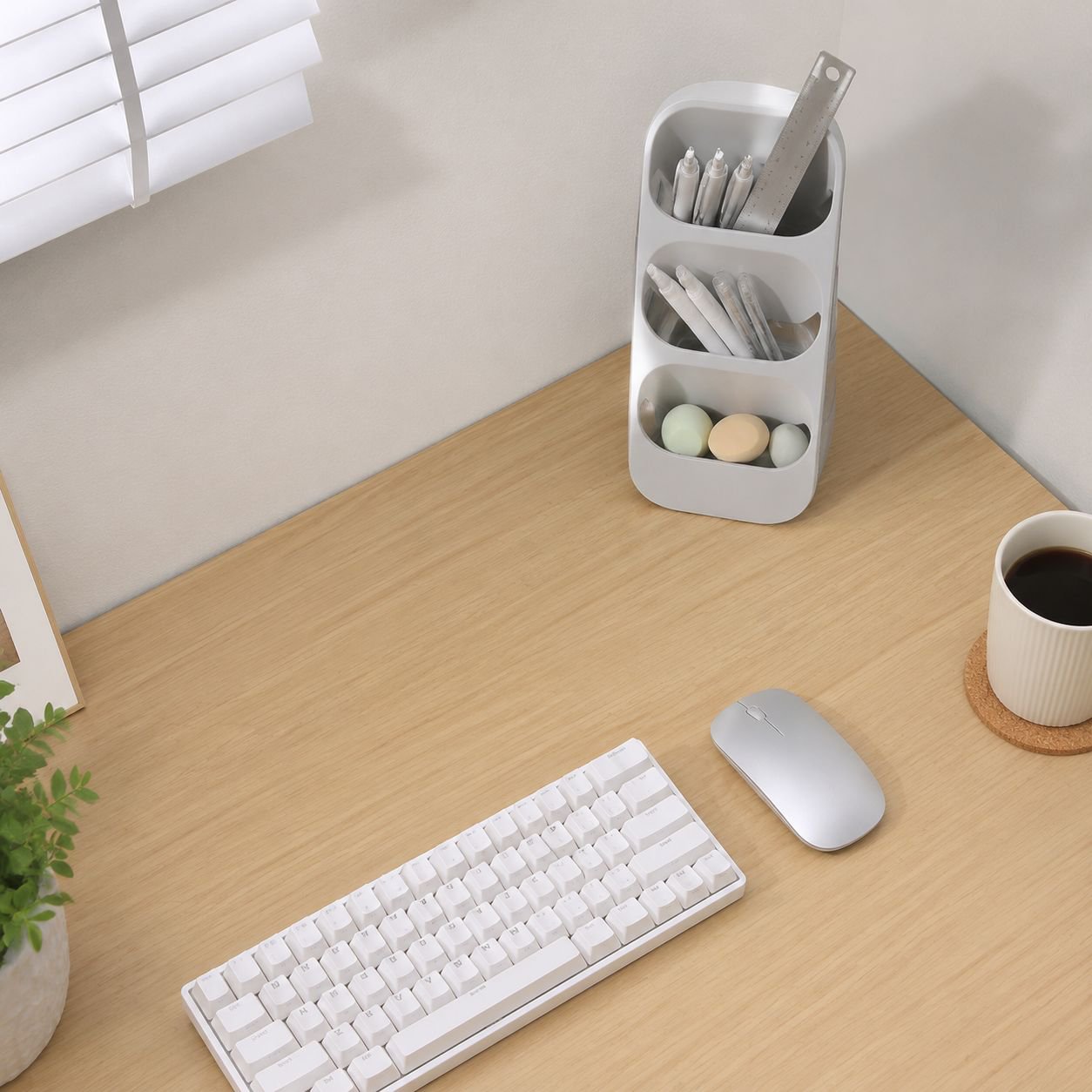 Neatly arranged office supplies in a minimalist storage box