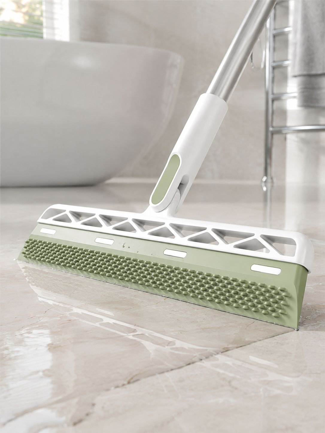 Magic broom sweeping dust and debris from a hard floor
