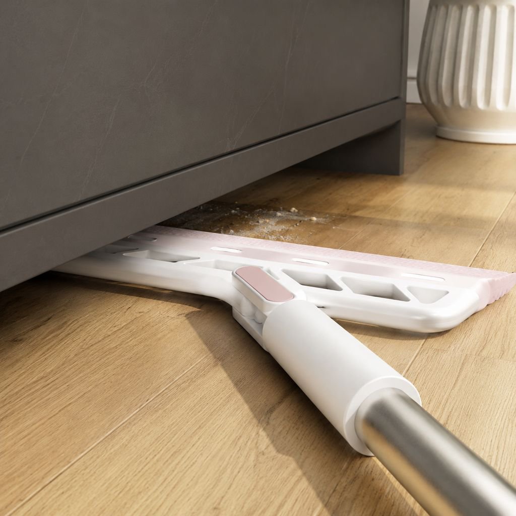 Magic Sweeper cleaning under furniture with ease