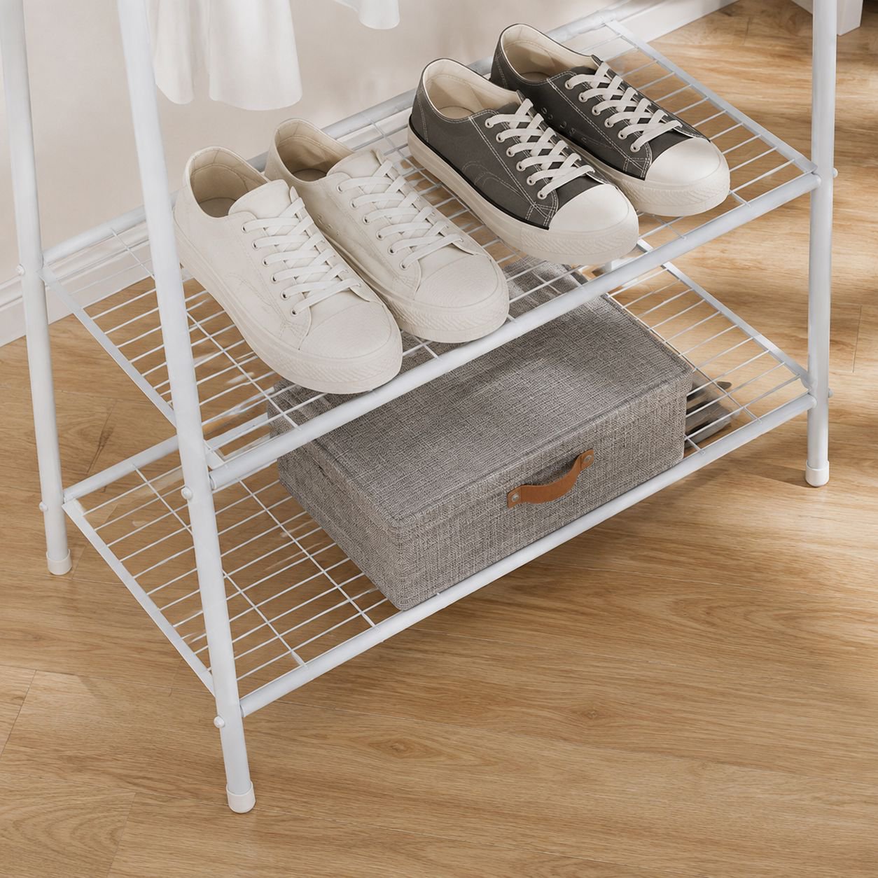Modern coat rack holding jackets, scarves, and bags