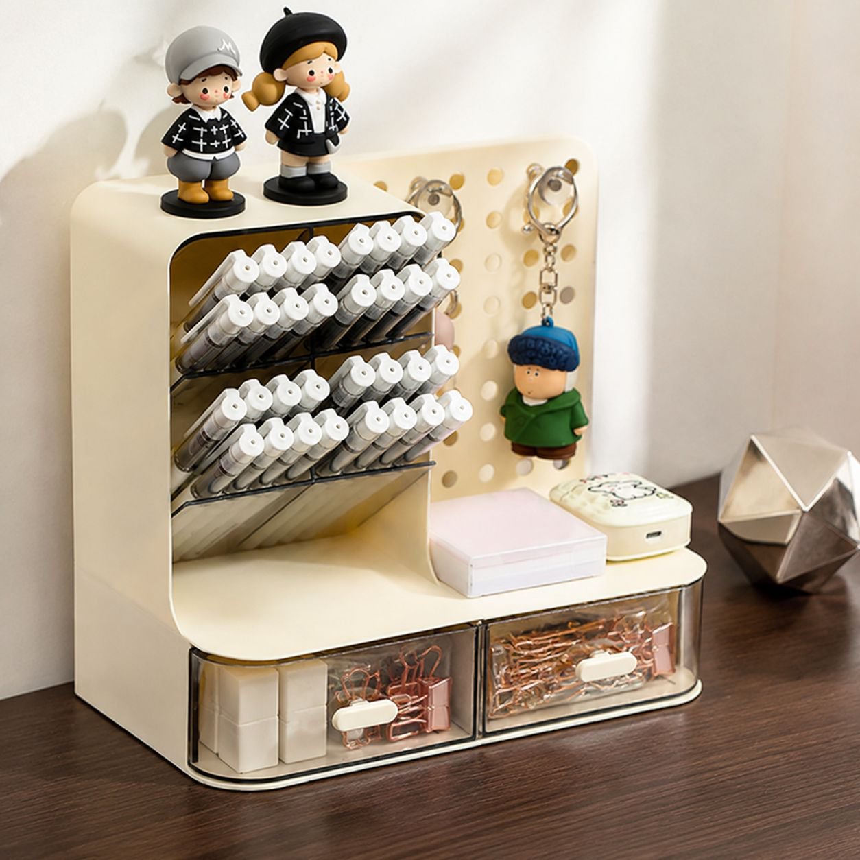 Close-up of pegboard design pen holder with pens and pencils