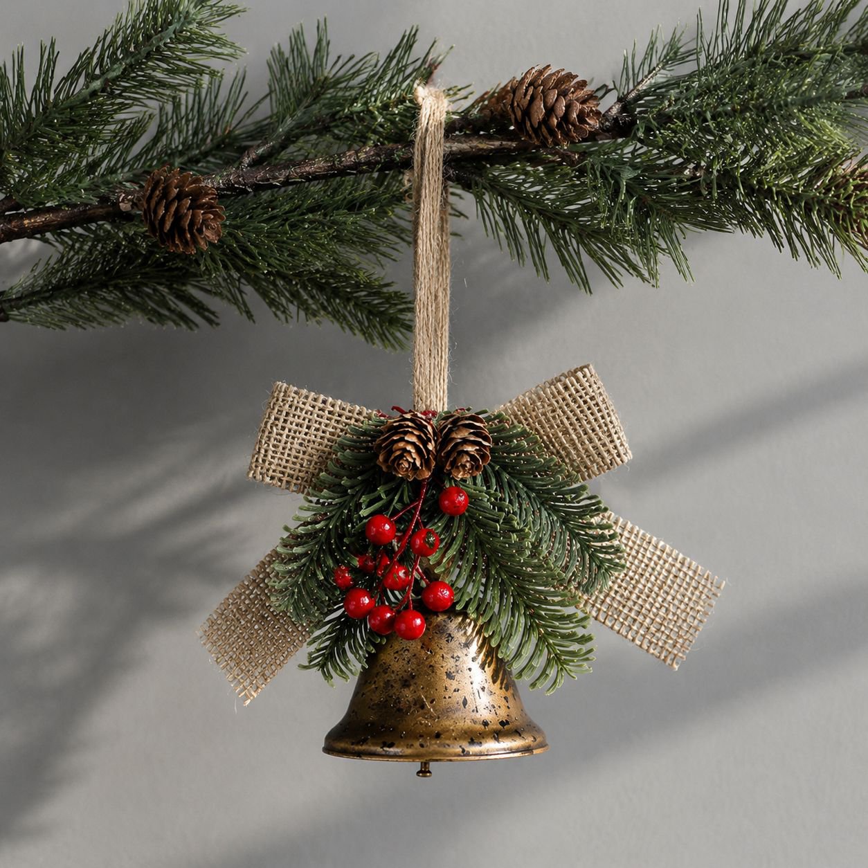 Holiday metal bell and bow ornament