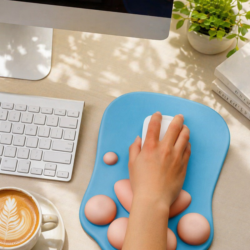 Cute and personalized silicone wrist rest mouse pad with cat paw design for computer laptops.