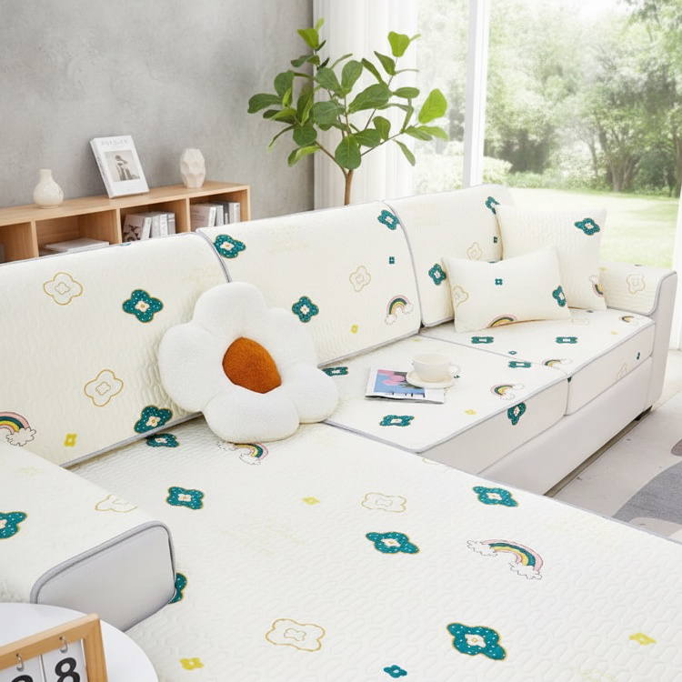 Easy-to-clean washable sofa mat on grey sofa