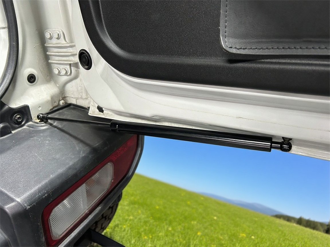 Amortiguador de puerta trasera instalado en coche