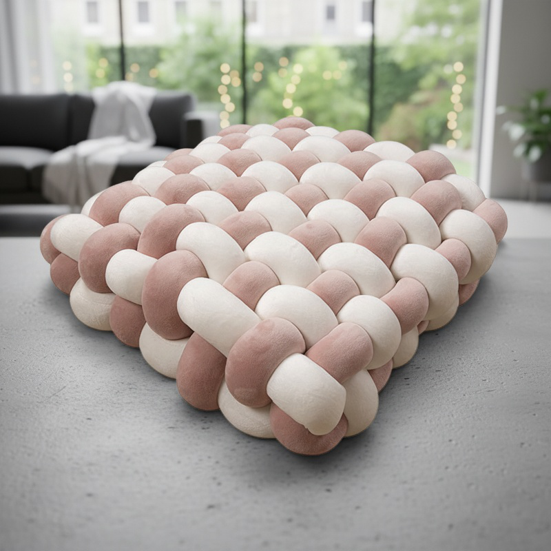 Comfortable knotted cushion on couch
