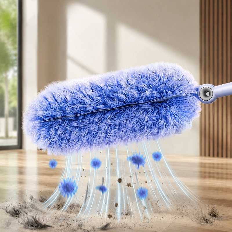 Hand holding the Electrostatic Cleaning Duster near a computer keyboard