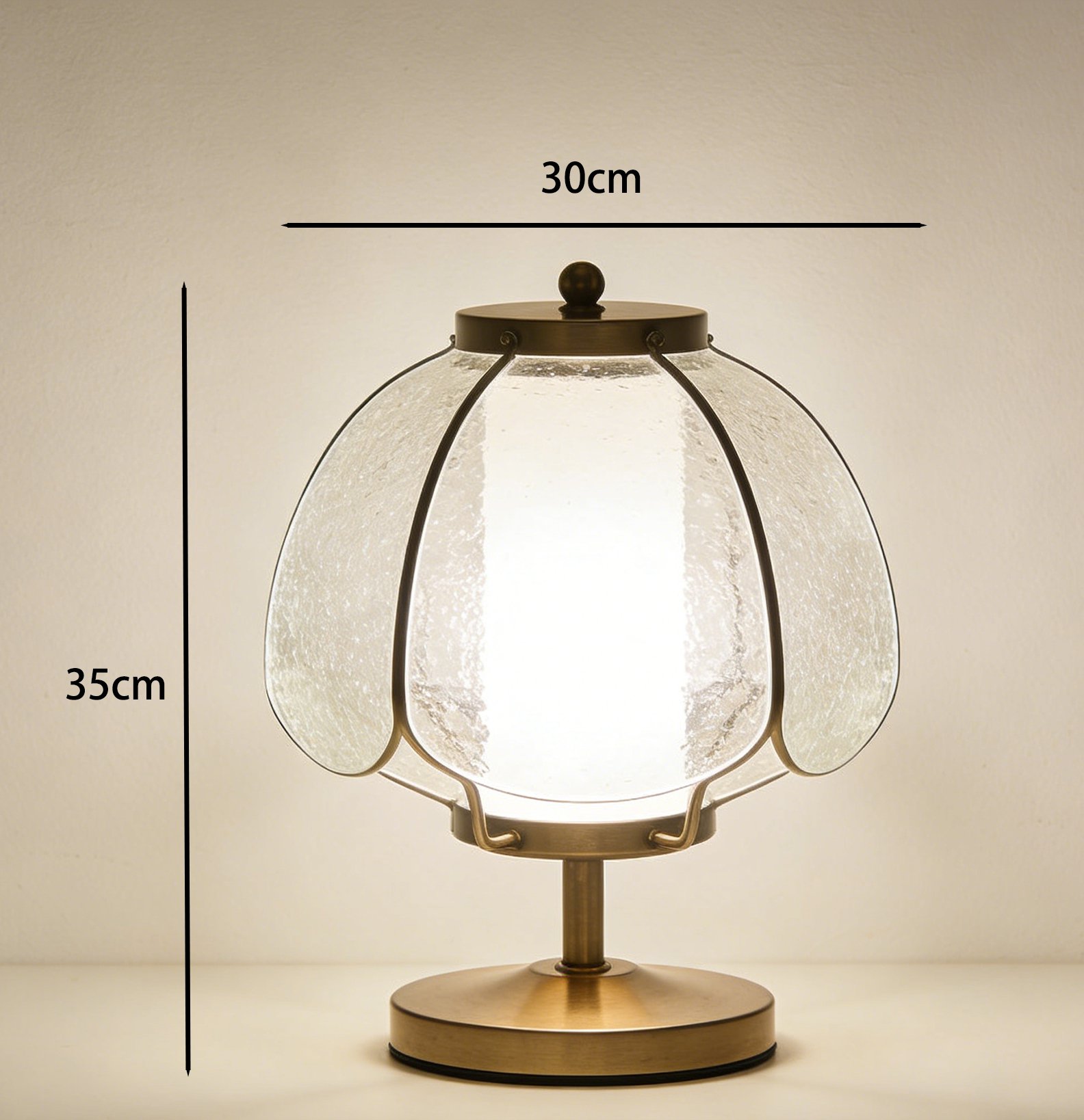 Vintage pumpkin shaped glass table lamp on wooden desk