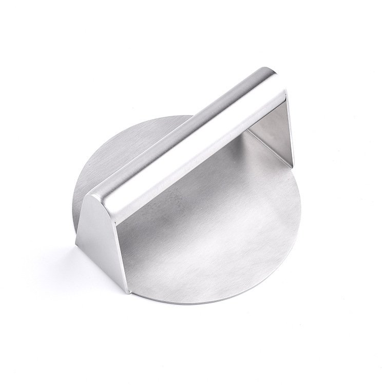 Round meat patty press creating uniform burger sizes