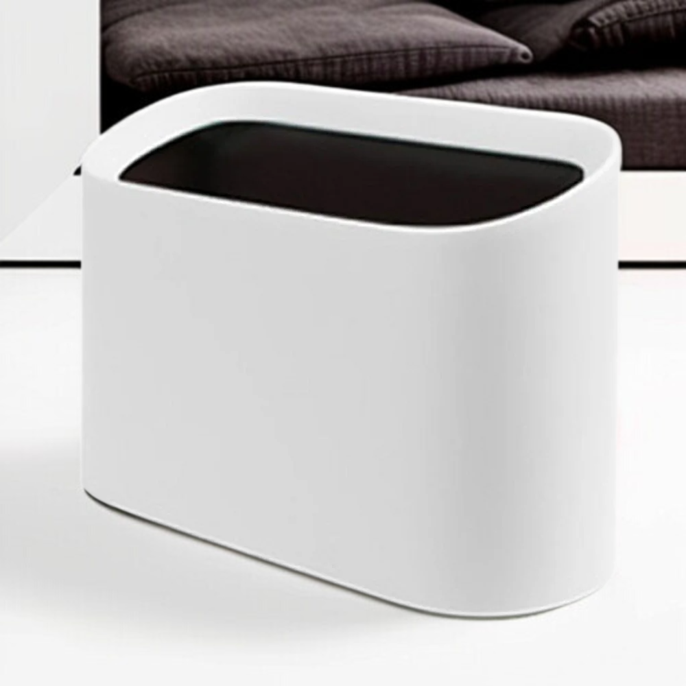 침실 머리맡에 놓인 미니 휴지통