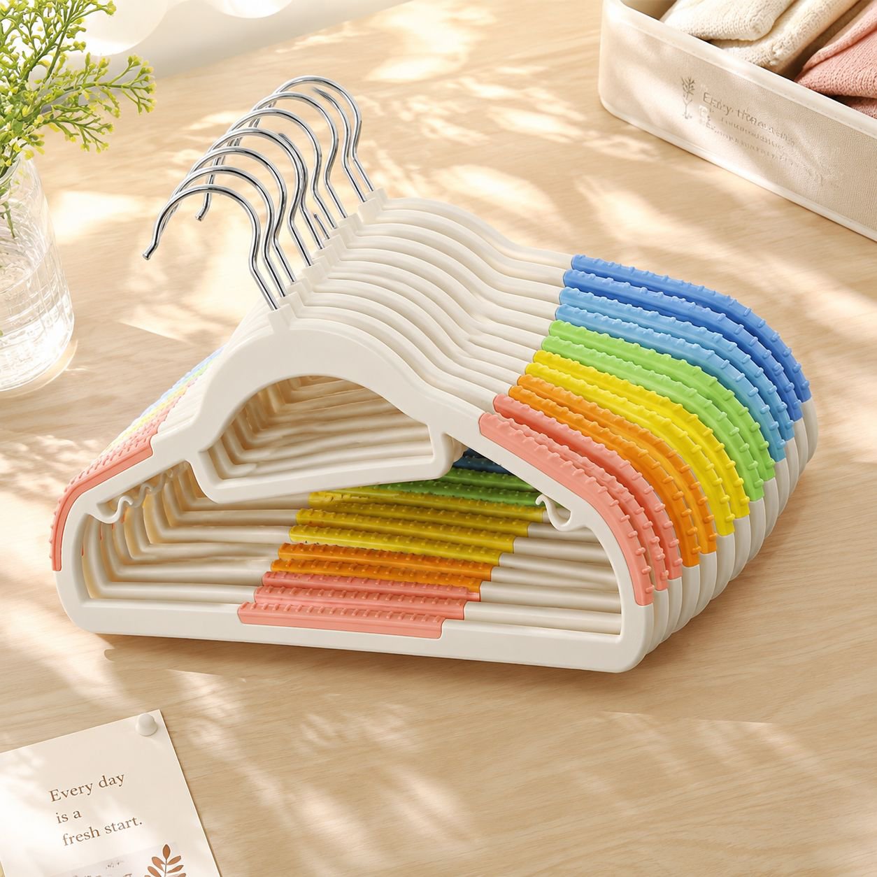 Stack of colorful plastic hangers for efficient storage
